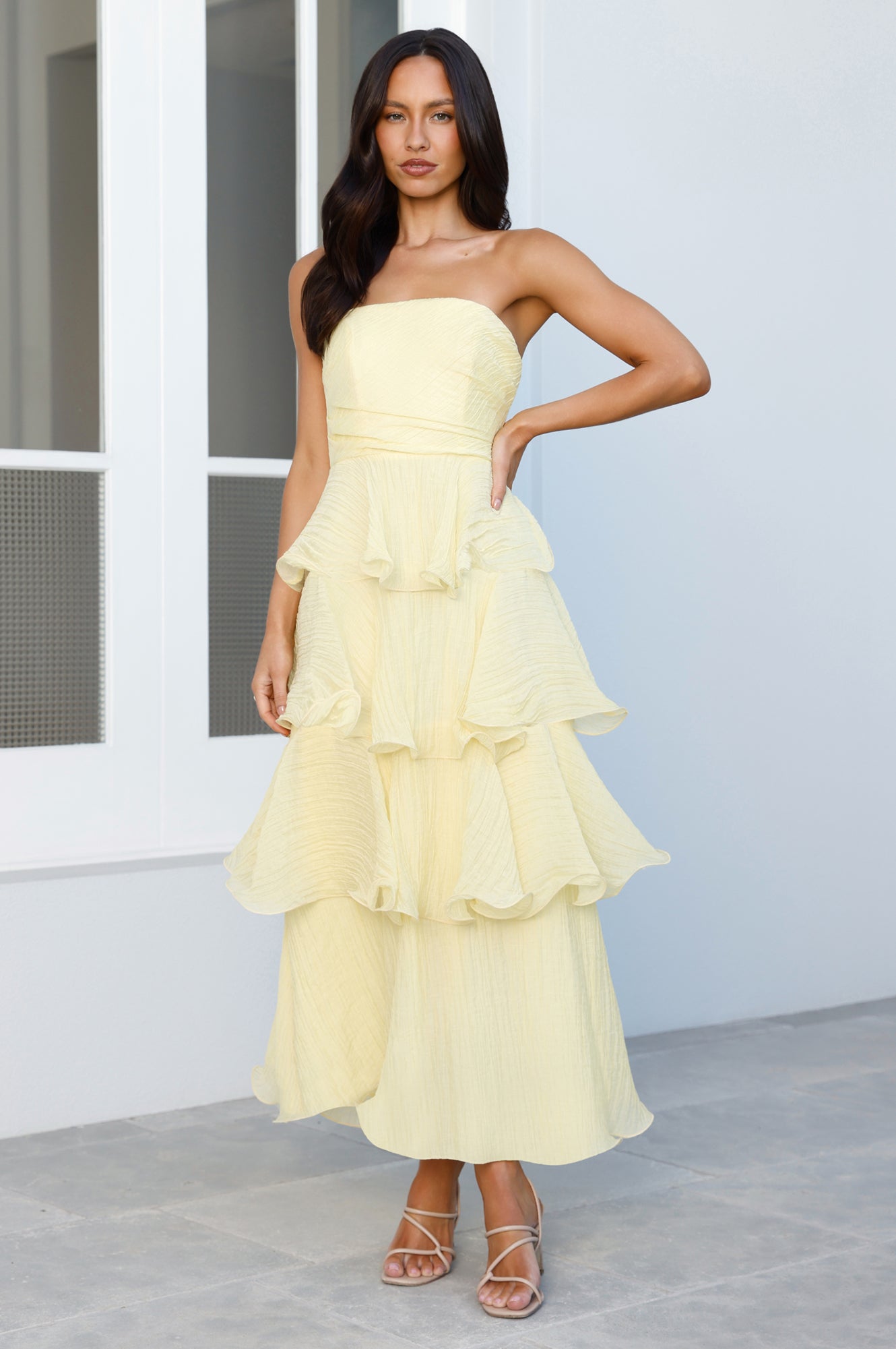 Feminine strapless party dress in pastel yellow