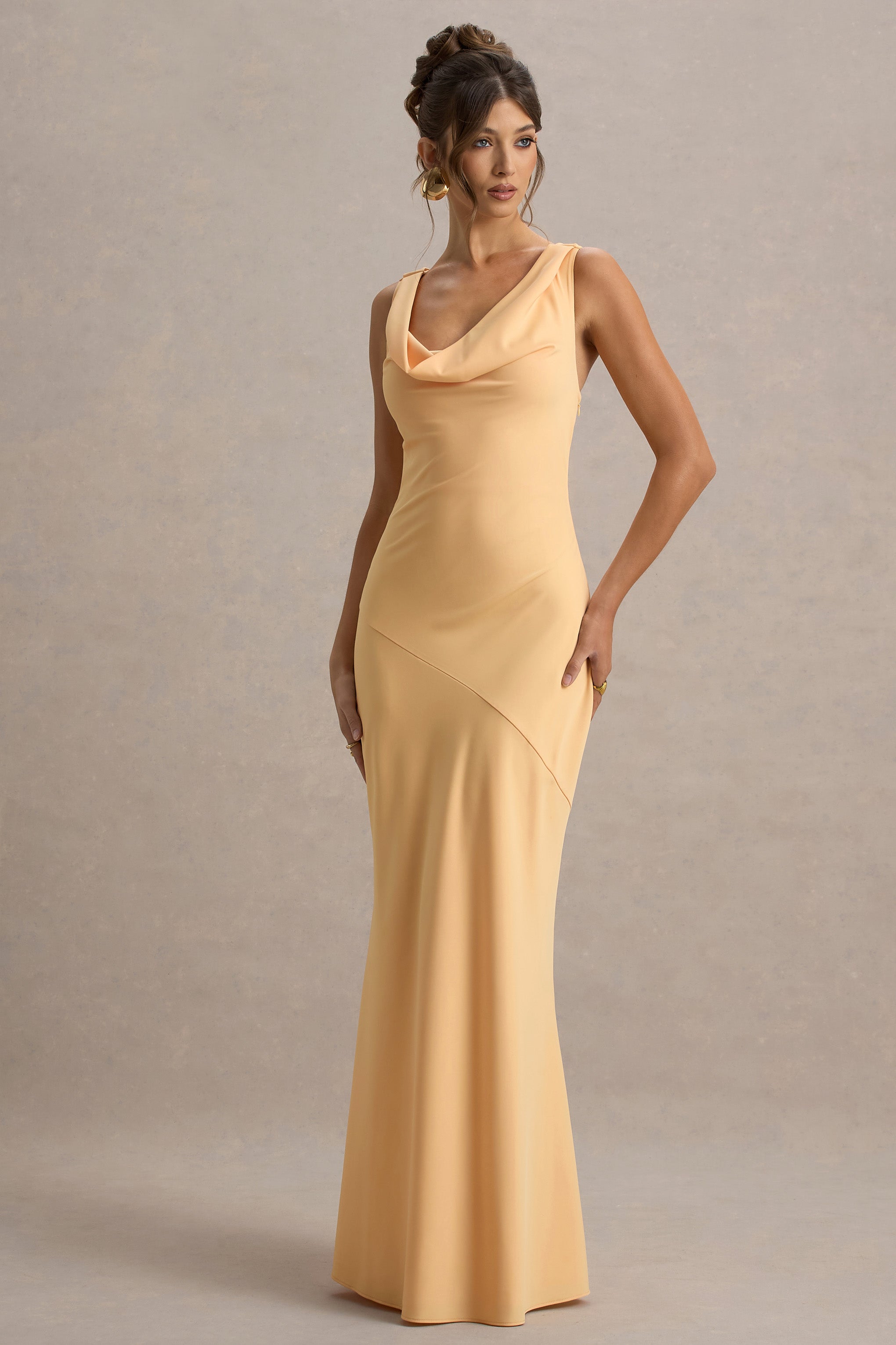 Soft gold maxi dress with elegant drape, side view